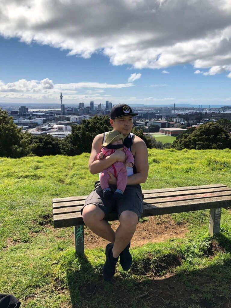 Charlie Chao with his son on top of Mt Eden in Auckland